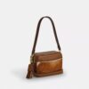 Mini Carey-crossbody-taske i hårkalv med ko-print
