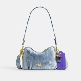Mini Carey-crossbody-taske i Loved Denim med Vedhæng