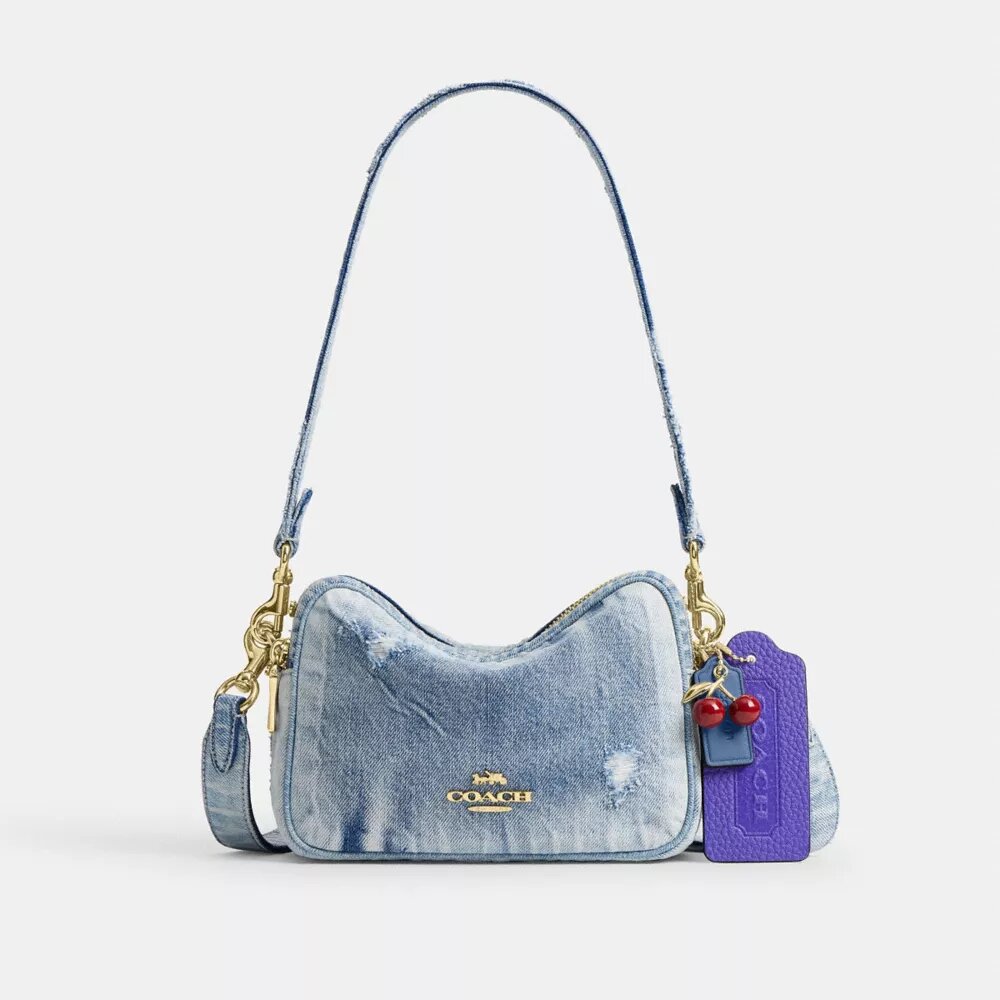 Mini Carey-crossbody-taske i Loved Denim med Vedhæng