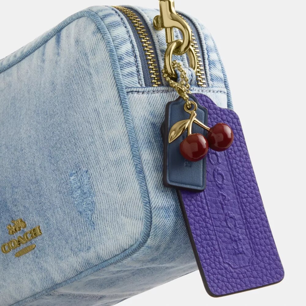 Mini Carey-crossbody-taske i Loved Denim med Vedhæng