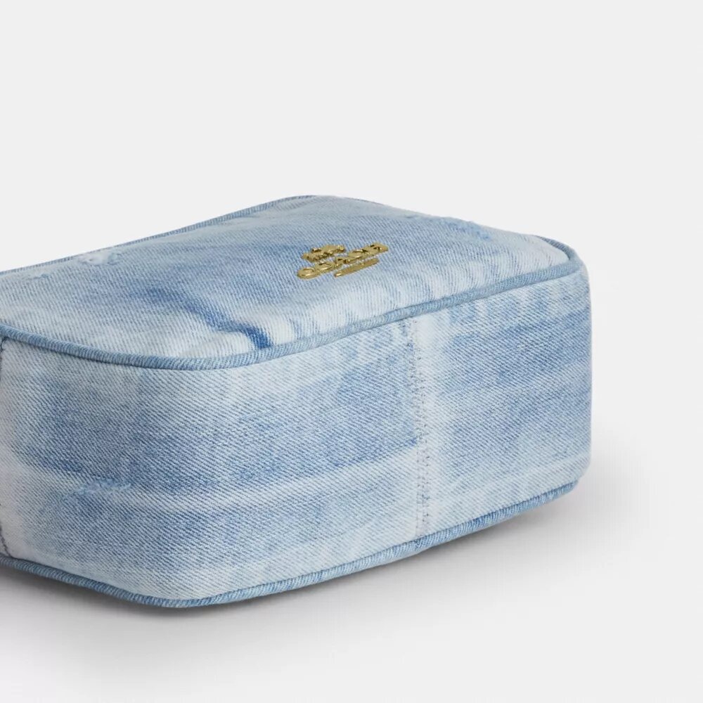 Mini Carey-crossbody-taske i Loved Denim med Vedhæng