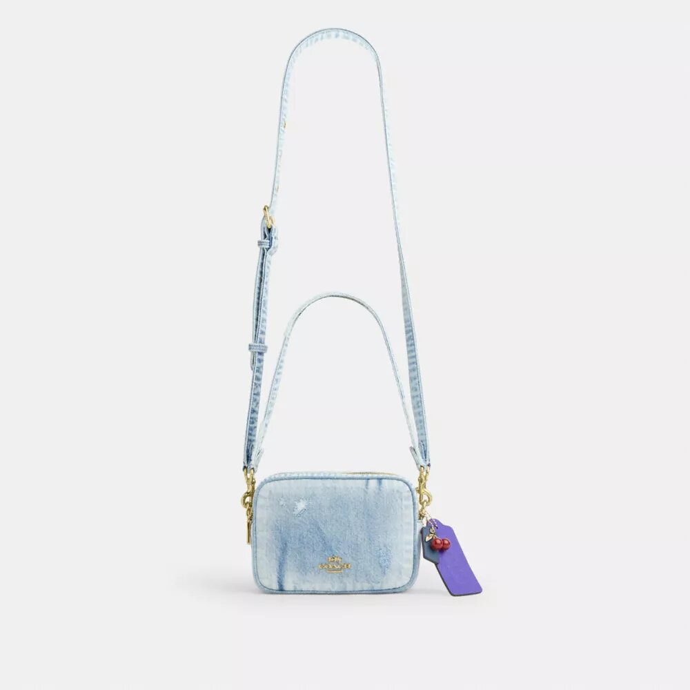 Mini Carey-crossbody-taske i Loved Denim med Vedhæng
