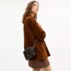 Mini Carey crossbody-taske i Loved Signature Canvas