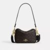 Mini Carey-crossbody-taske i Signature Canvas