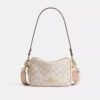 Mini Carey-crossbody-taske i Signature Canvas