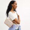 Mini Carey-crossbody-taske i Signature Canvas
