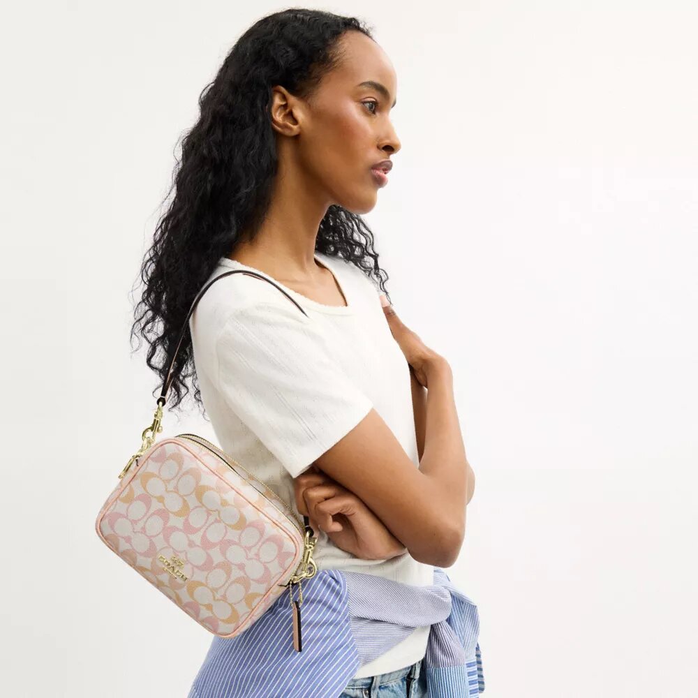 Mini Carey-crossbody-taske i Signature Canvas