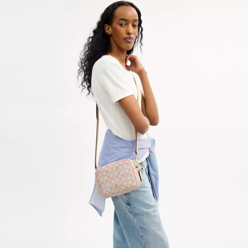 Mini Carey-crossbody-taske i Signature Canvas