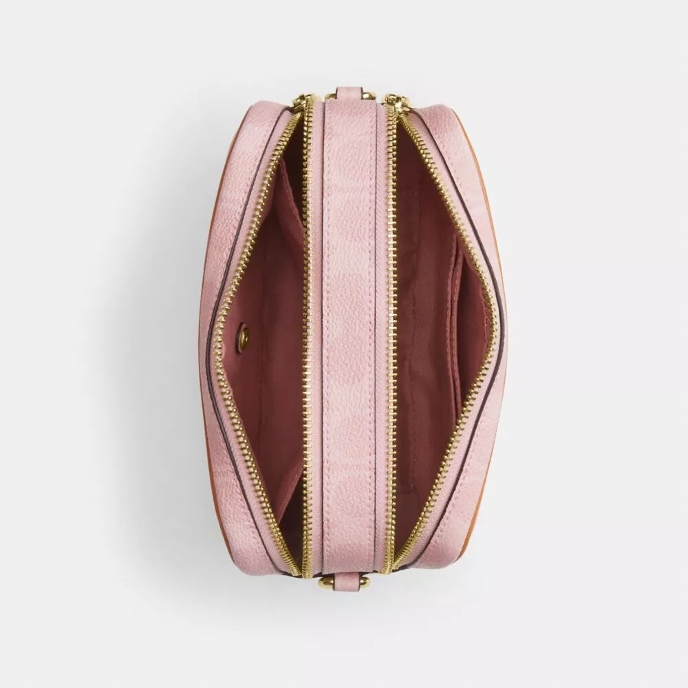 Mini Carey-crossbody-taske i Signature Canvas med Vedhæng