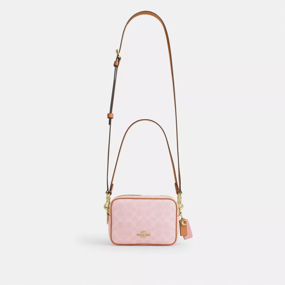 Mini Carey-crossbody-taske i Signature Canvas med Vedhæng