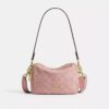 Mini Carey-crossbody-taske i Signature Denim