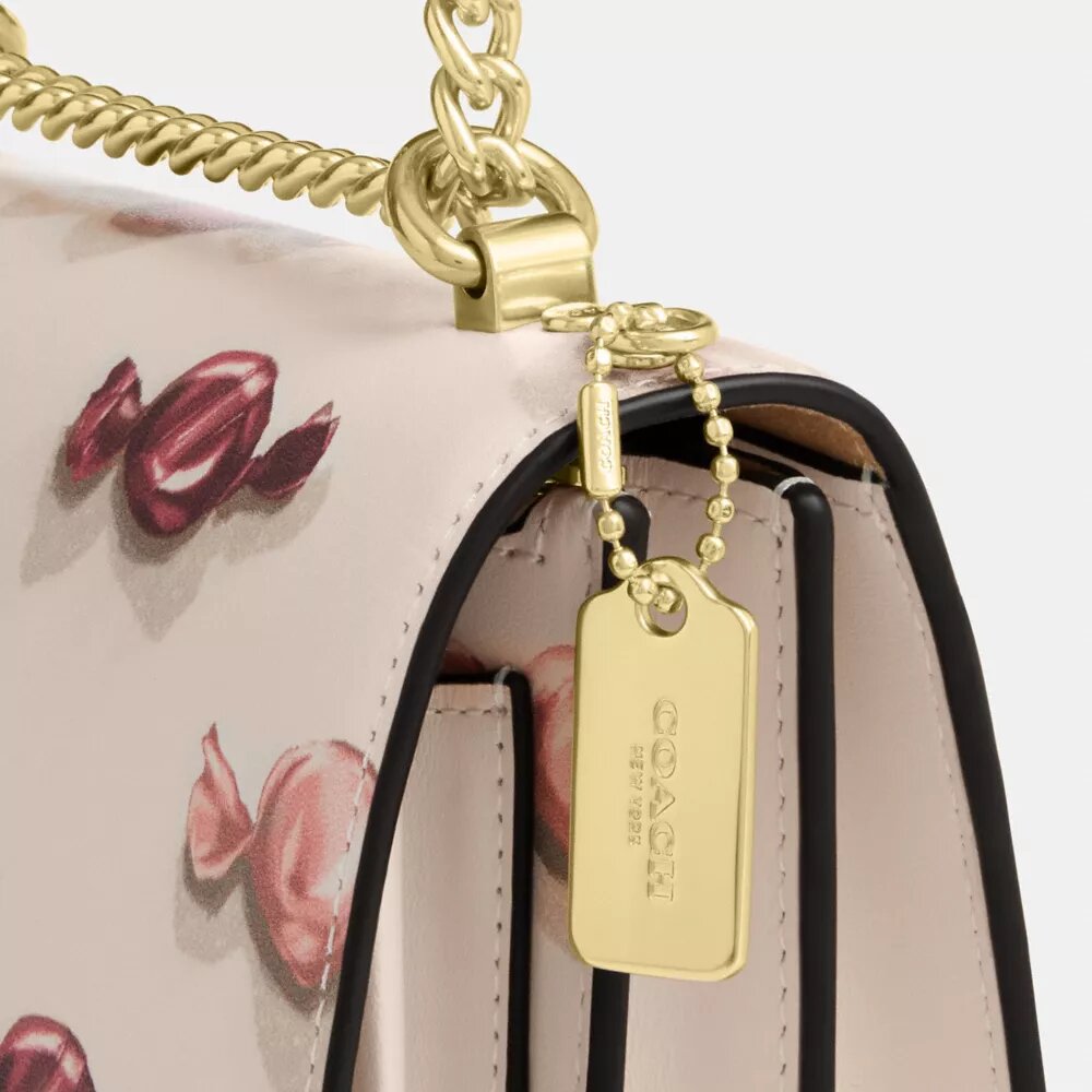 Mini Klare crossbody-taske med slik-print