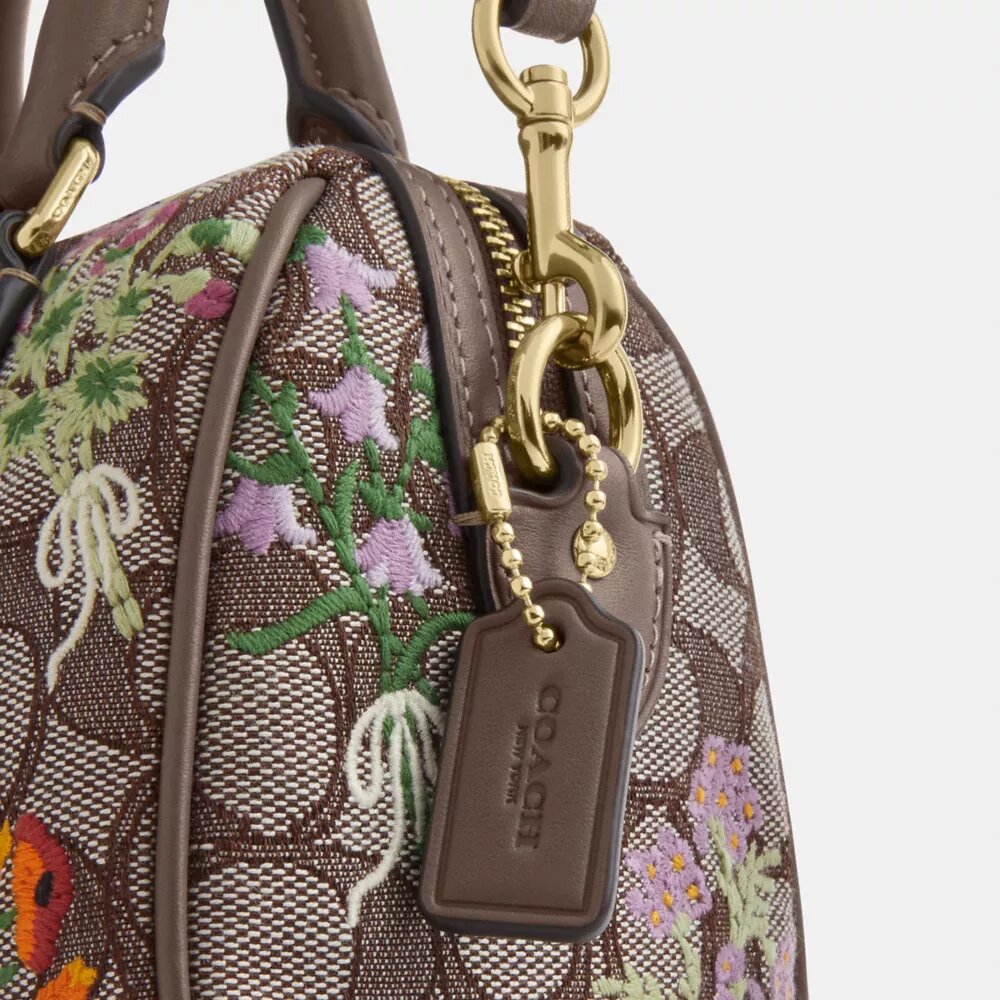Mini Rowan crossbody-taske i signatur-jacquard med blomsterbroderi