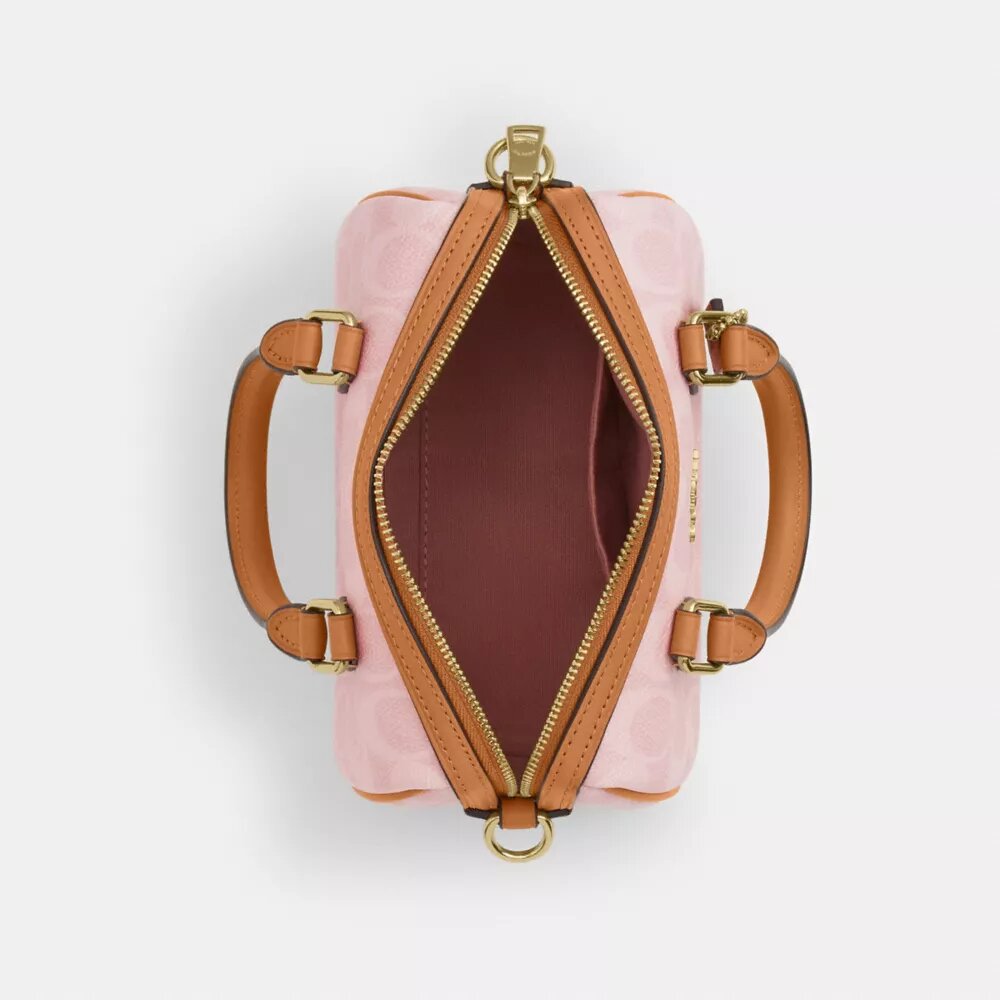 Mini Rowan crossbody-taske i Signature Canvas med Vedhæng
