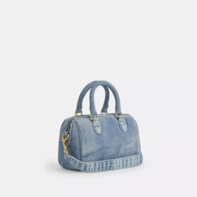 Mini Rowan crossbody-taske i slidt denim med vedhæng