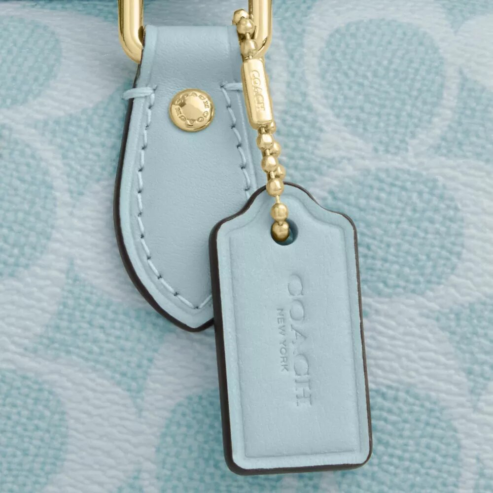 Mini Rowan crossbody-tasker i Signature Canvas