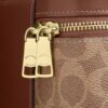Rainer crossbody-taske 18 i Signature Canvas