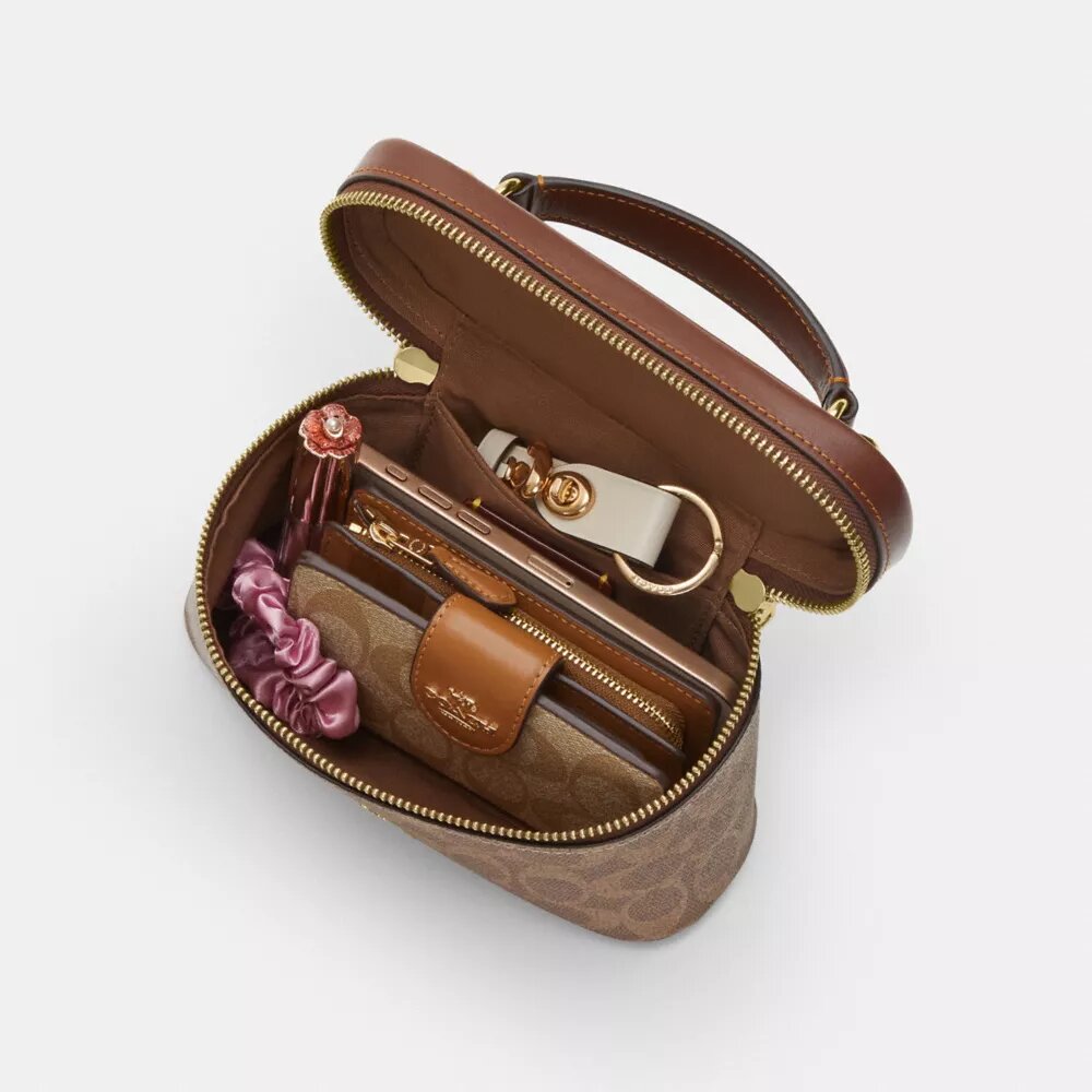 Rainer crossbody-taske 18 i Signature Canvas