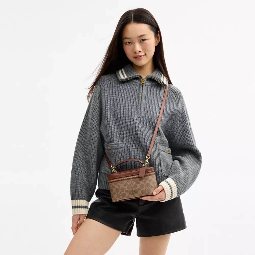 Rainer crossbody-taske 18 i Signature Canvas