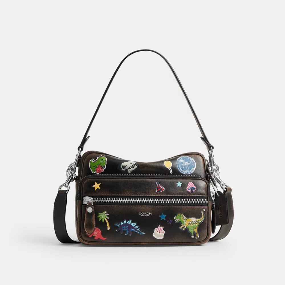 Rexy 10-års fødselsdag Dakota crossbody-taske i patineret læder med klistermærketryk