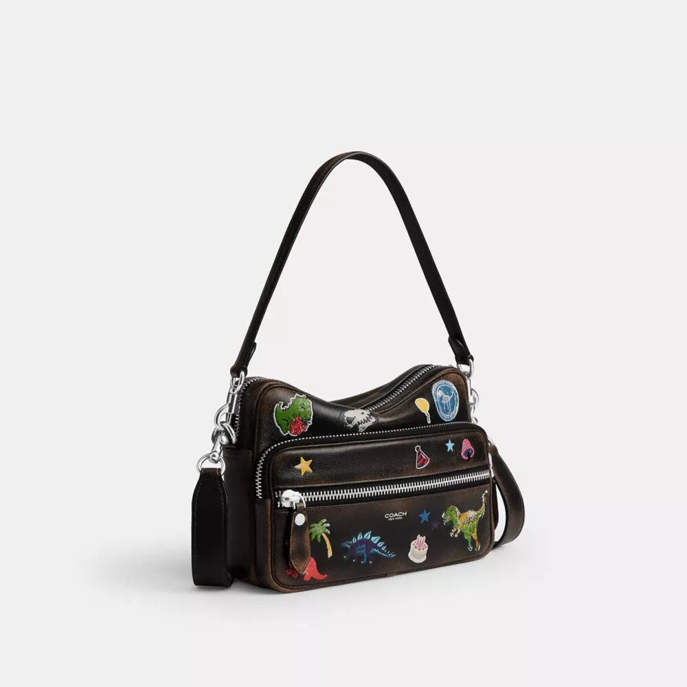 Rexy 10-års fødselsdag Dakota crossbody-taske i patineret læder med klistermærketryk
