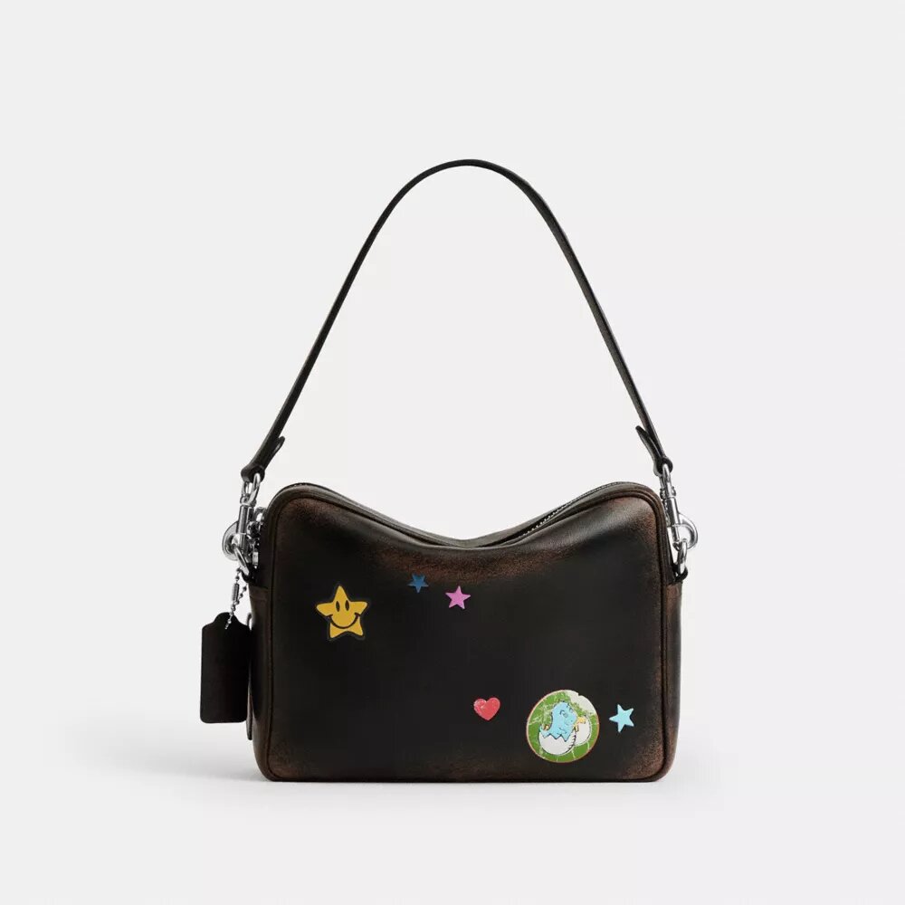 Rexy 10-års fødselsdag Dakota crossbody-taske i patineret læder med klistermærketryk