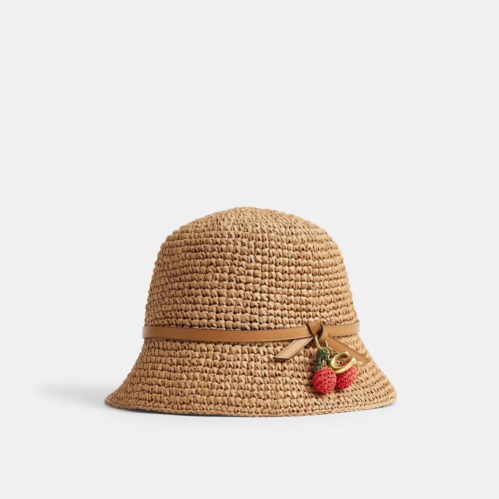 Stråhat med kirsebærdetalje