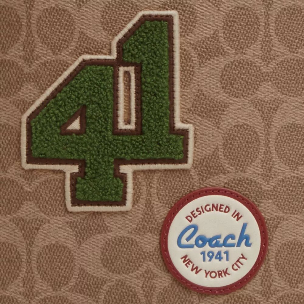 Sullivan-rygsæk i Signature Canvas med patches