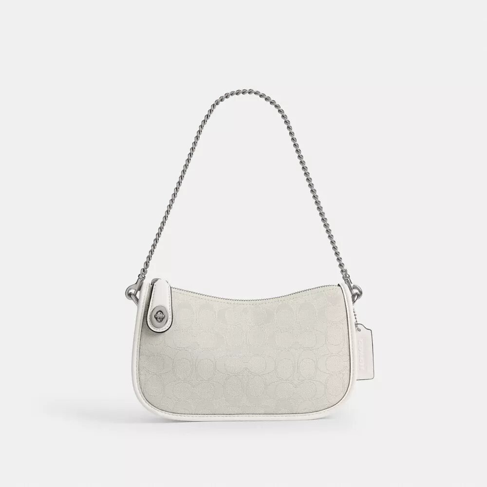 Swinger-tasker i signatur-jacquard