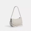 Swinger-tasker i signatur-jacquard