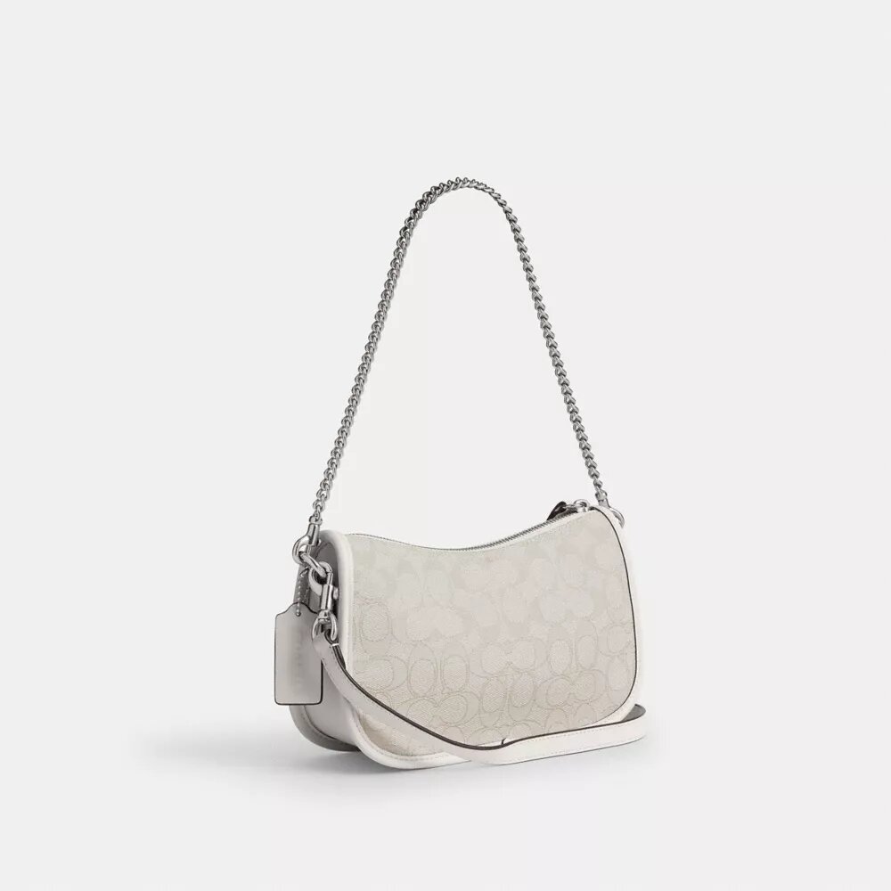 Swinger-tasker i signatur-jacquard