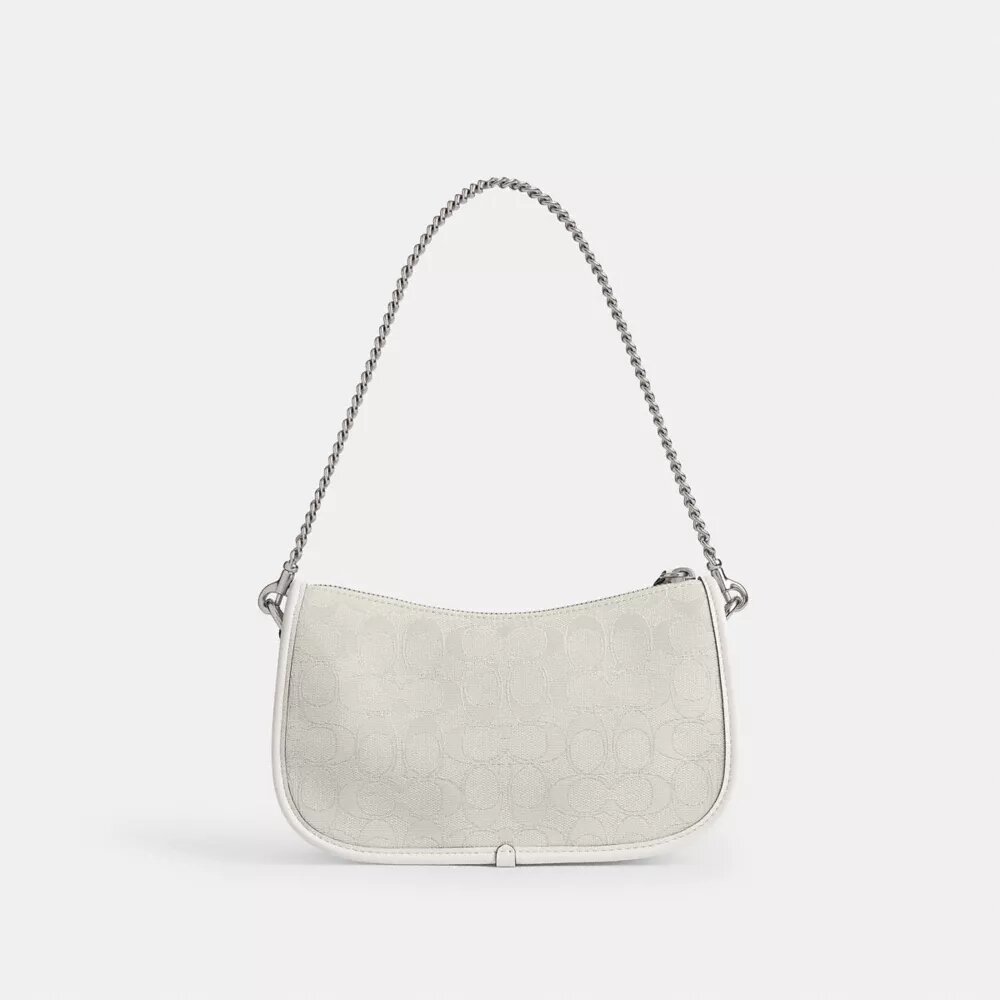 Swinger-tasker i signatur-jacquard