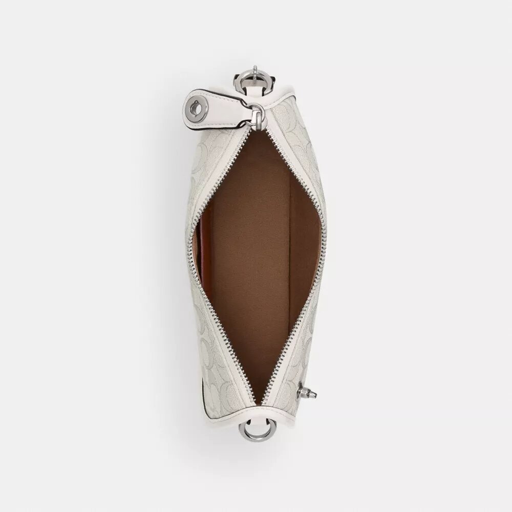 Swinger-tasker i signatur-jacquard