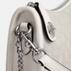 Swinger-tasker i signatur-jacquard