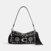 Tabby skuldertaske 26 med western-nitter