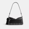 Tabby skuldertaske 26 med western-nitter