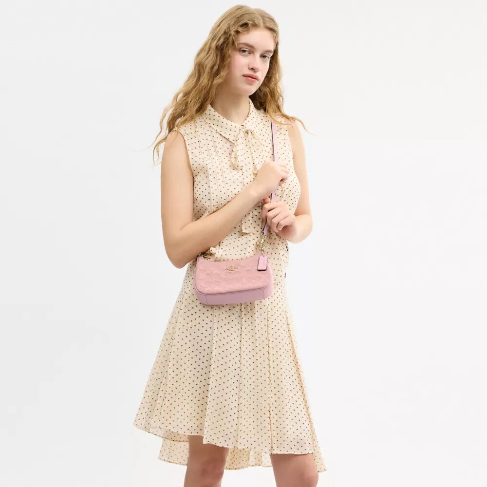 Teri Mini-crossbody-taske i signaturdenim