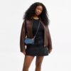 Teri Mini-crossbody-taske i signaturdenim