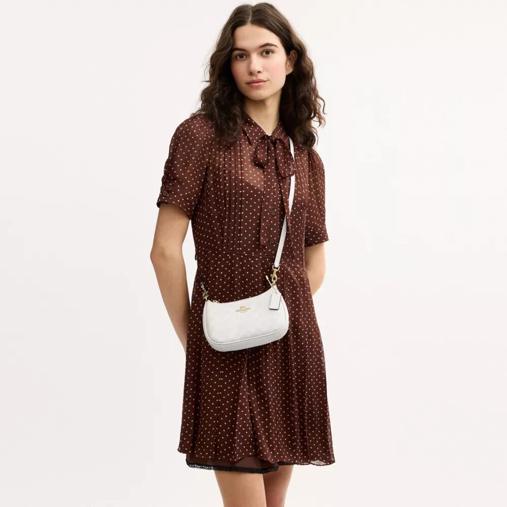Teri Mini-crossbody-taske i Signature Canvas