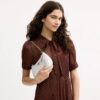 Teri Mini-crossbody-taske i Signature Canvas