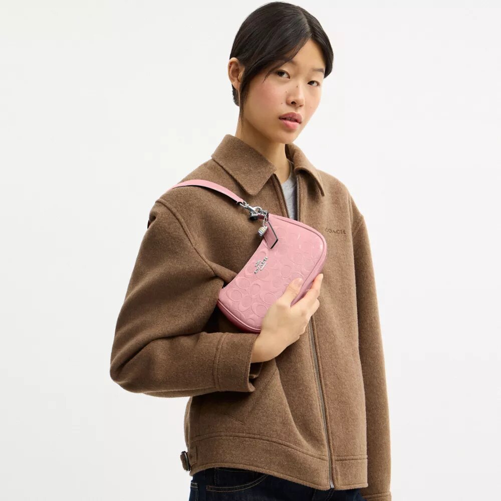 Teri Mini-crossbody-taske i signaturlæder med hjertevedhæng