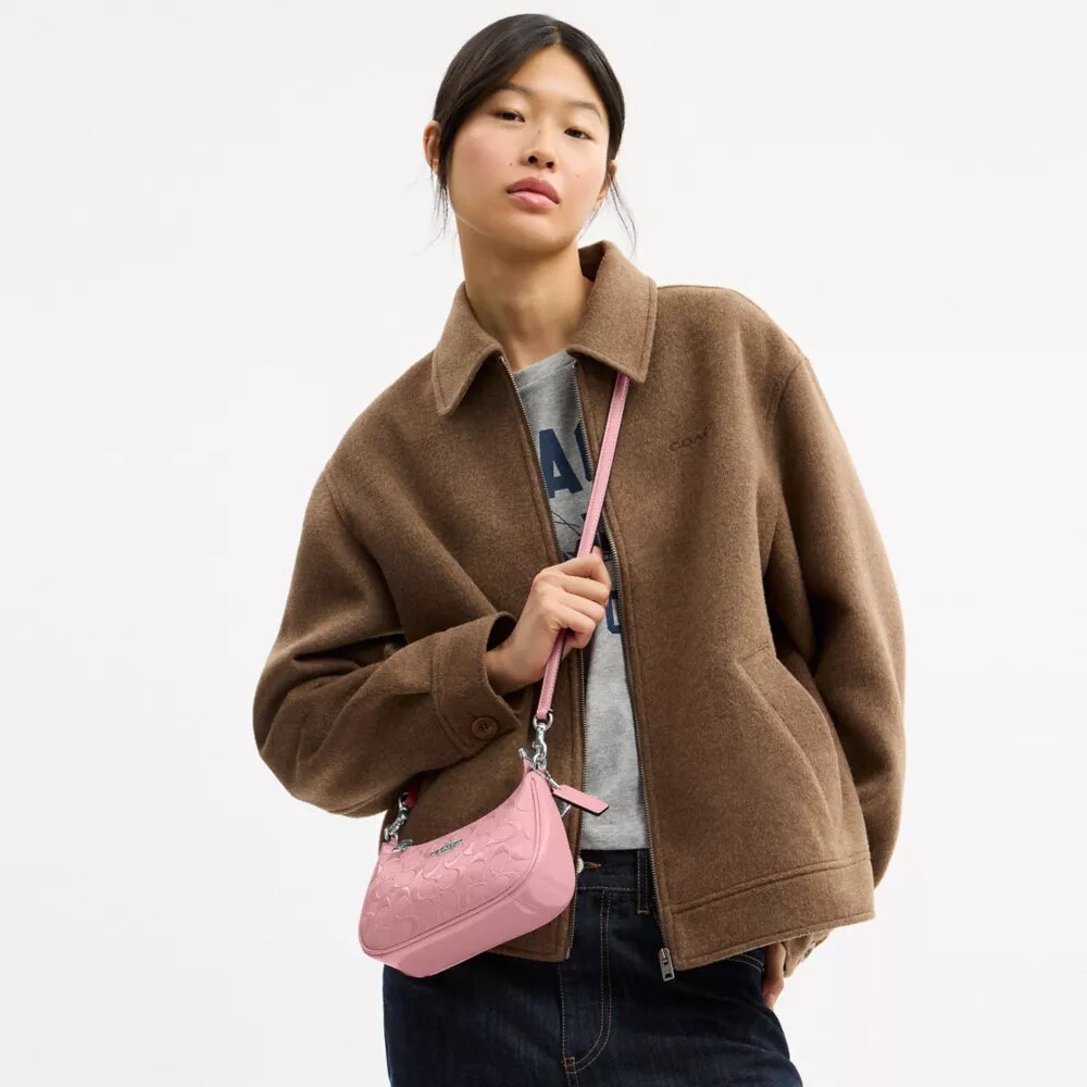 Teri Mini-crossbody-taske i signaturlæder med hjertevedhæng