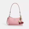 Teri Mini-crossbody-taske i signaturlæder med hjertevedhæng