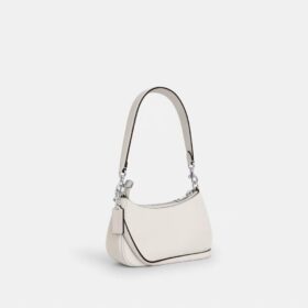 Teri Mini-crossbody-taske med blomsterapplikation